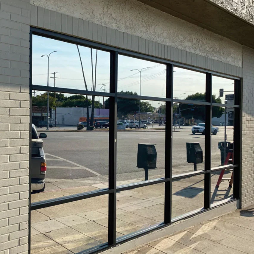 Commercial exterior reflective window film installation completed by First Class Detail